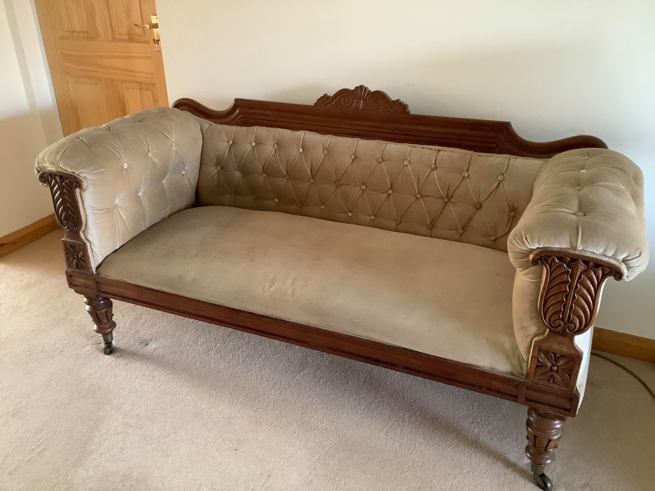 antique bed used as a sofa