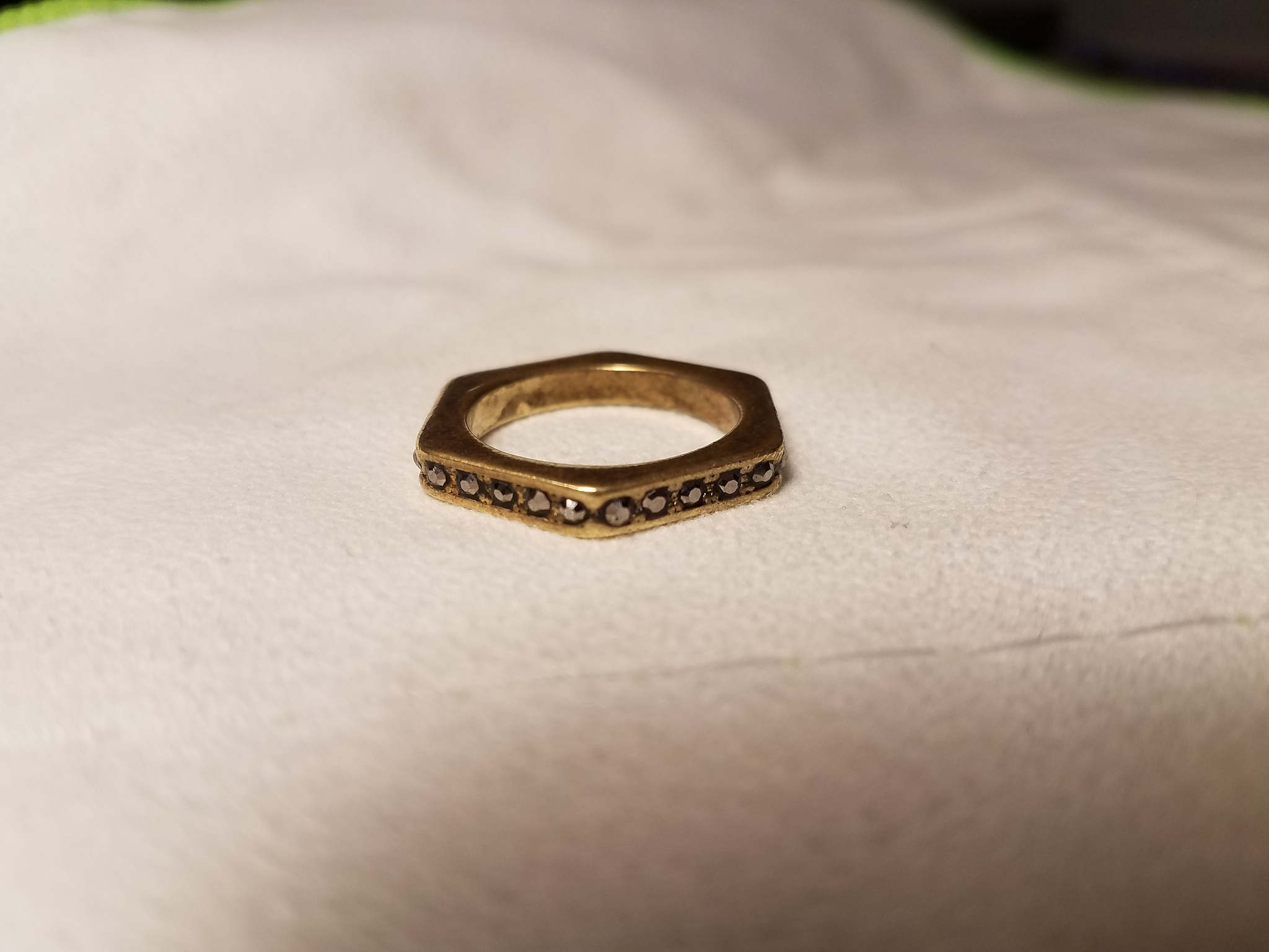 Funky hexagonal gold(tone/colored) ring with stones around the edges ...