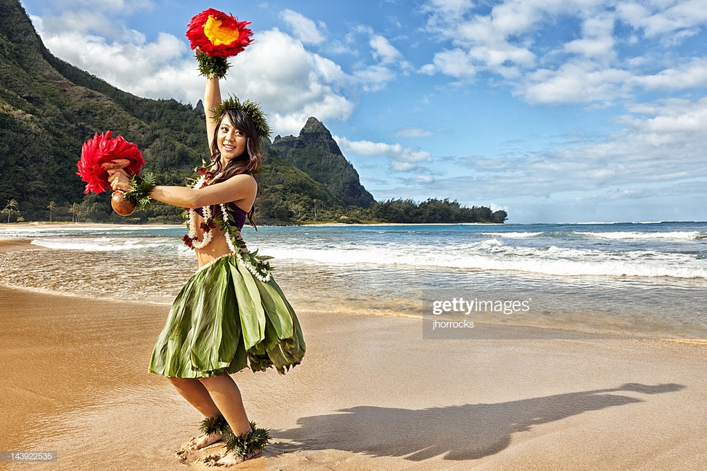 hawaiian-hula-dancer-on-beach-with-red-feather-shakers-picture-id143922535.jpg