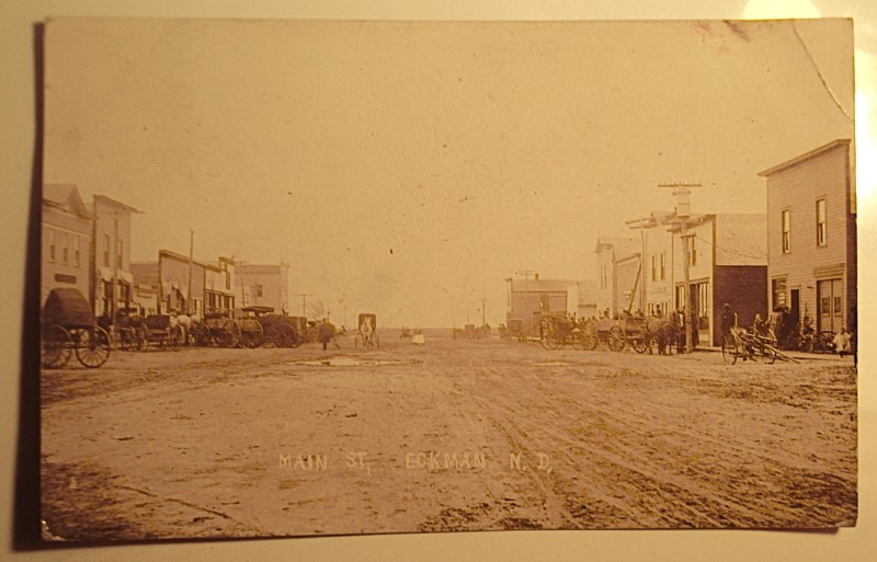 postcard eckman north dakota main street wagons.jpg