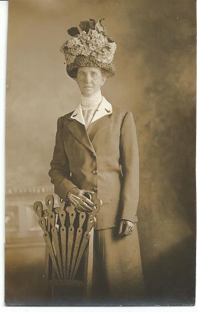 Tall Lady in Hat behind odd chair RPPC.jpg