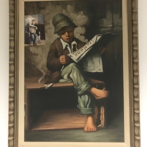 Boy reading newspaper