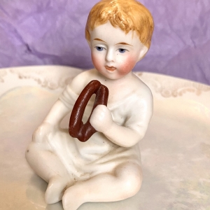 Porcelain little boy figurine