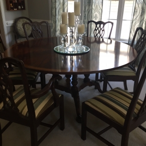 Pedestal mahogany table and Chippendale chairs