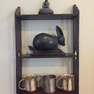 Display shelves and monogrammed silver cups