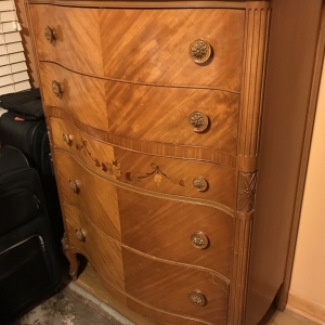 Tall dresser with inlaid design